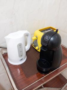 a coffee maker and a toaster on a shelf at Charming house in Teror with garden in Teror