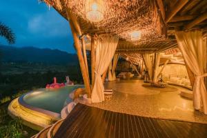 a resort with a swimming pool and a resort at Bamboo Villa with Amazing mount agung view in Selat