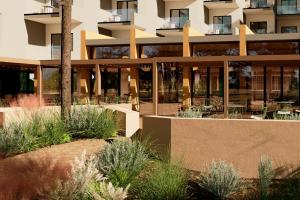 an exterior view of a building with plants at Aura by Aubamar in Playa de Palma