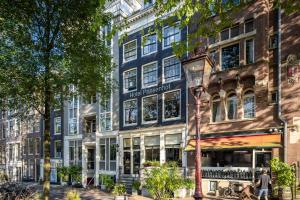 a rendering of a building on a city street at Hotel Prinsenhof Amsterdam in Amsterdam +12 photos