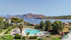 an aerial view of a resort with boats in the water at Hotiday Vulcano Porto in Vulcano