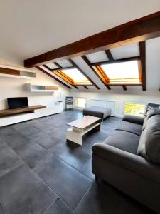 a living room with a couch and a table at CARDAHAUSe Via DANTE 12 in Cogliate