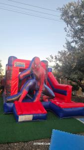 a spider man on a slide at a playground at extreme park in Deir Ḥannā