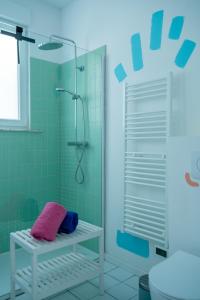 a bathroom with a shower with green tiles at Cool Cool House in Liège +148 photos