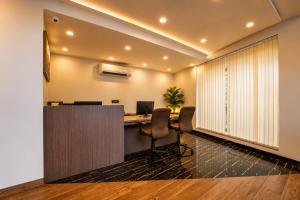 an office with a desk with a computer on it at Ramatan Resort in Vagator