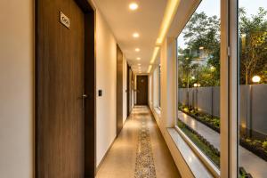 a corridor of a house with a walkway at Ramatan Resort in Vagator
