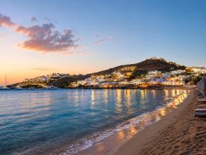 a view of the beach in positano at sunset at Cyclades Blue in Ornos