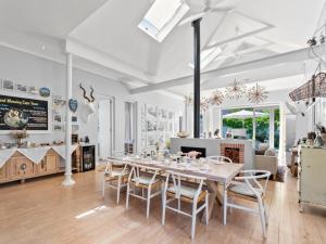a dining room with a table and chairs at Himmelblau Boutique Bed and Breakfast in Cape Town