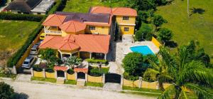 an aerial view of a house with a swimming pool at Elegant Villa in Nagua with Private Pool and Jacuzzi in Nagua
