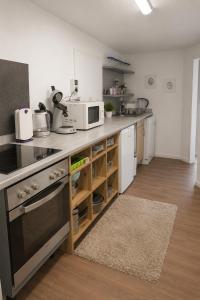 a kitchen with a counter with a microwave on it at M&M Apartments in Augustdorf
