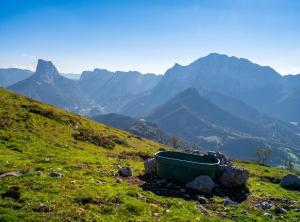 a bath tub sitting on top of a hill with mountains at Appartement chaleureux à Gresse-en-Vercors 43 m² vue montagne in Gresse-en-Vercors