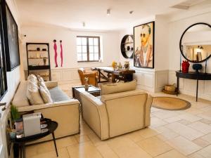a living room with two couches and a table at Castro Mesembria Boutique Hotel in Nesebar