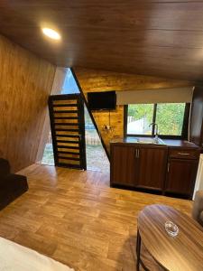 a kitchen and living room of a tiny house at arida farm peach in Bcharré