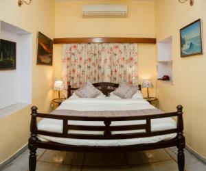 a bedroom with a bed in a room at Madhuban - A Heritage Home in Jaipur +51 photos