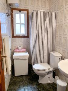 a bathroom with a toilet and a shower curtain at Cosy Studio with Sea View and Garden in Frontera - 20 m² in Frontera