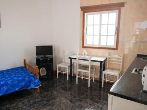 a kitchen and dining room with a table and chairs at Cosy Studio with Sea View and Garden in Frontera - 20 m² in Frontera +19 photos