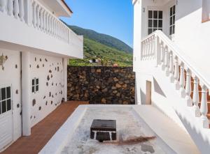 a view from the courtyard of a house with a balcony at Exceptional Studio in Frontera | 25 sq.m. | Terrace in Frontera