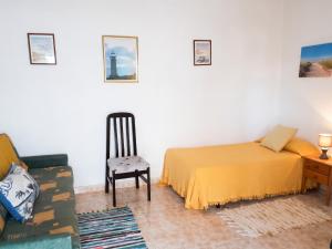 a bedroom with a bed and a chair and a desk at Exceptional Studio in Frontera | 25 sq.m. | Terrace in Frontera