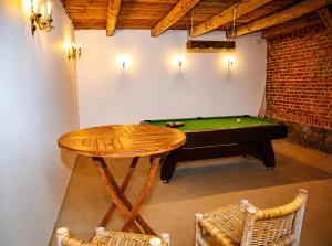 a room with a pool table and a ping pong table at 5 Stars in Jabłonka Stara