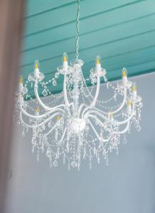 a white chandelier hanging from a ceiling at "LOS" 2 Neoclassic Harbour View in Symi