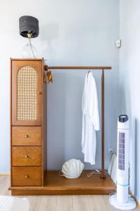 a room with a dresser and a shelf with a dresser at "LOS" 2 Neoclassic Harbour View in Symi