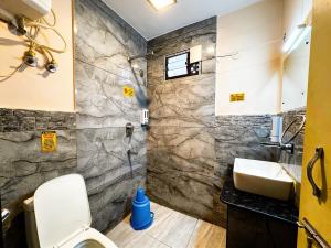 a bathroom with a sink and a shower at Hotel Ambrosia in Gangtok