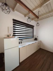 a kitchen with a sink and a window at בצלי-ה in Safed