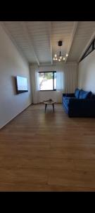 a living room with a couch and a table at בצלי-ה in Safed +4 photos
