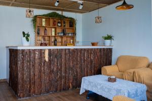 a bar in a room with two chairs and a table at The Edge Villa & Retreat in Pokhara