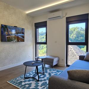 a living room with a couch and a table at Etno selo Azbuka in TrÅ¡iÄ‡