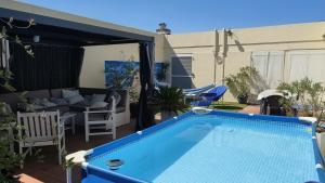 a swimming pool in the middle of a yard at Maison avec patio in Arles