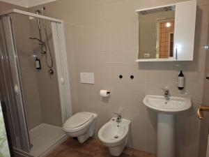a bathroom with a toilet and a sink and a shower at B&B Campisi Anna in Altamura +20 photos