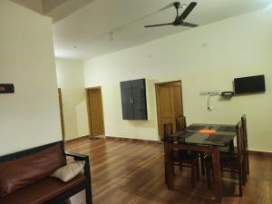 a living room with a couch and a table at Mount View Attappadi in Agali