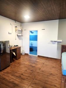 a room with a room with a door and a desk at Mount View Attappadi in Agali
