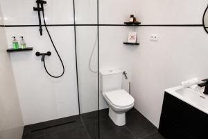 a bathroom with a toilet and a shower and a sink at 5 Stars in Jabłonka Stara +39 photos