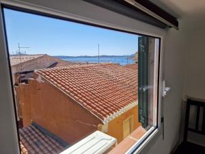 a view from a window of a roof at Calaluna in La Maddalena