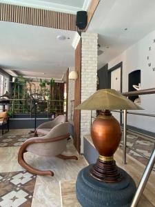 a lobby with a chair and a lamp on a table at dolunaydın hotel in Side