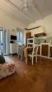 a kitchen with a table and chairs in a room at Al numero 15 in Castel Gandolfo