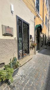 a building with a door on the side of a street at Al numero 15 in Castel Gandolfo