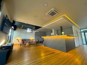 a living room with a wooden floor and a bar at Swan in Belgrade +9 photos