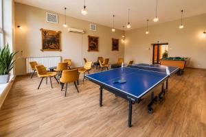 a room with a ping pong table and chairs at Dom Wczasowy GLOBUS in Ustroń +23 photos