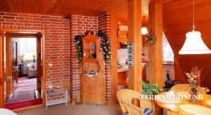 a room with a brick wall and a table and chairs at Potsdamer Ferienwohnung in Potsdam