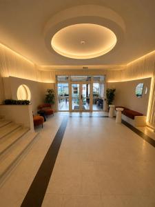 a large lobby with a large ceiling at Hotel Gala in Cluj-Napoca