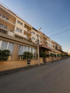 a building on the side of a street at Hotel Gala in Cluj-Napoca +40 photos