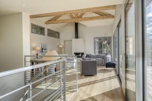 a room with a staircase and a living room at Wooden Villa 4 in Veyrier-du-Lac