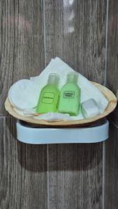 two complimentary soap on a plate on a table at NATIVE SOULS Beach Hotel in Induruwa