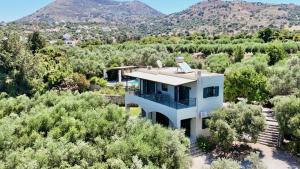 an aerial view of a house with mountains in the background at Villa Nynemia Almyrida Crete in Plaka