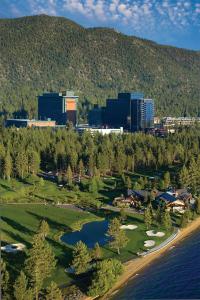 an aerial view of a golf course with a city at Harrah's Lake Tahoe Hotel & Casino - A Caesars Rewards Destination in Stateline