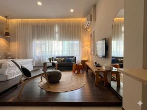 a living room with a couch and a table at Ho.Me-Easyhouse in Tainan