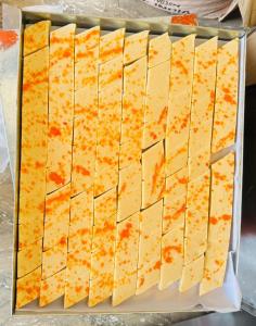 a tray filled with cheese pizzas on a table at Mi HOMESTAY in Bikaner